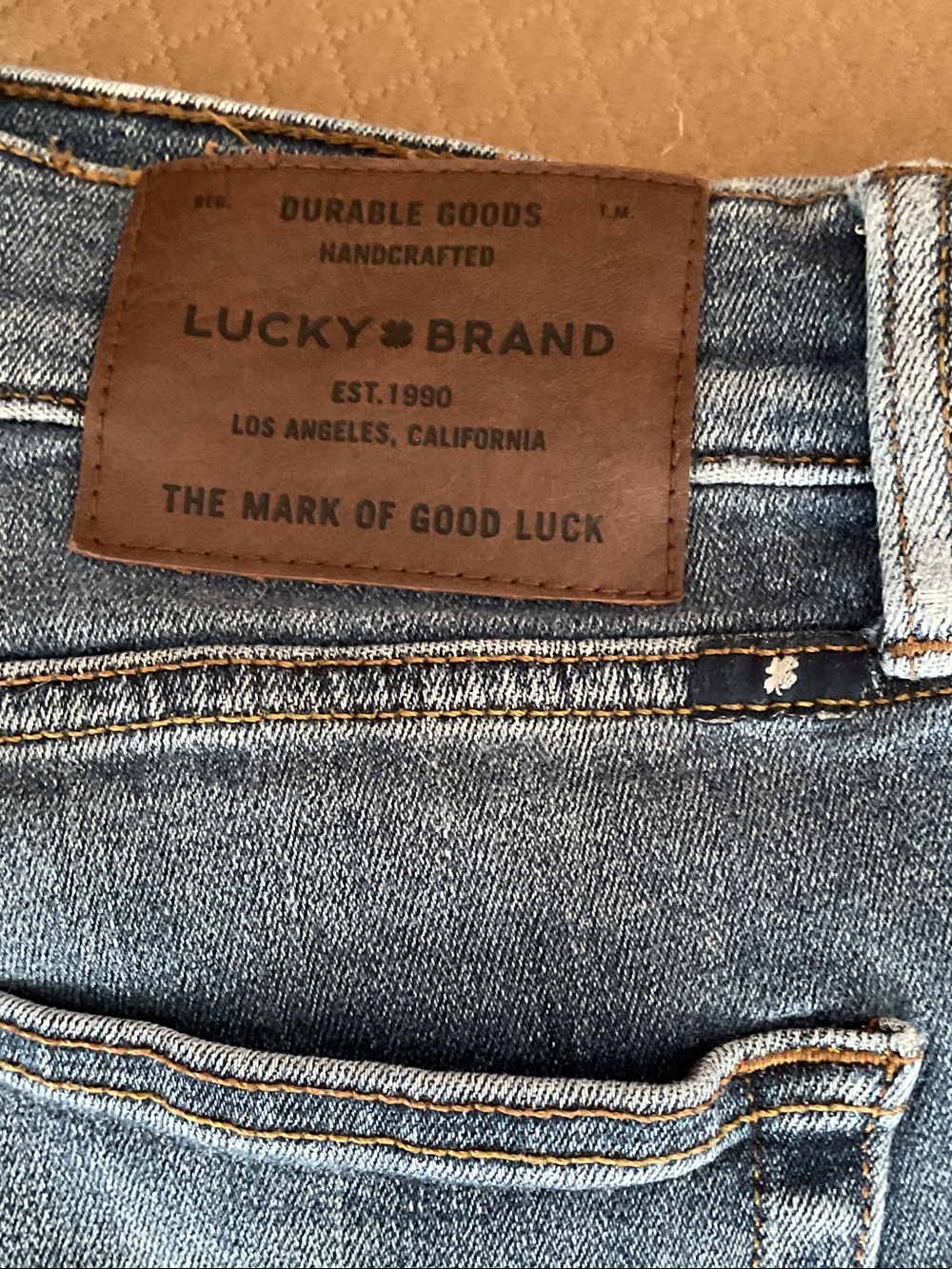Lucky Brand Slim Straight Denim Jeans in Medium Blue with Brown Patch